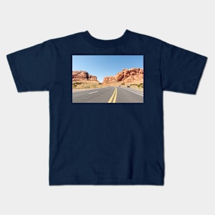 Yellow lines down middle of road through desert Kids T-Shirt